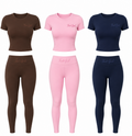 Set of colorful athletic wear including t-shirts and leggings on a white background.