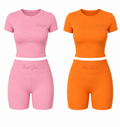 Four sets of colorful outfits in pink, orange, brown, and pink on a white background.